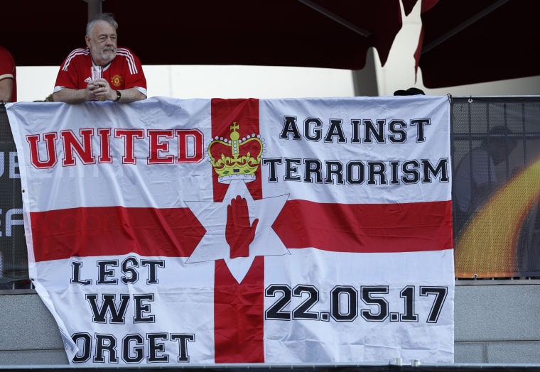 Image: Manchester United fans display a banner 