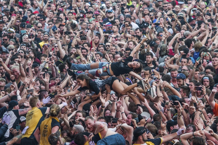 Image: Fans crowd surf at the Rock On The Range music festival in Columbus, Ohio