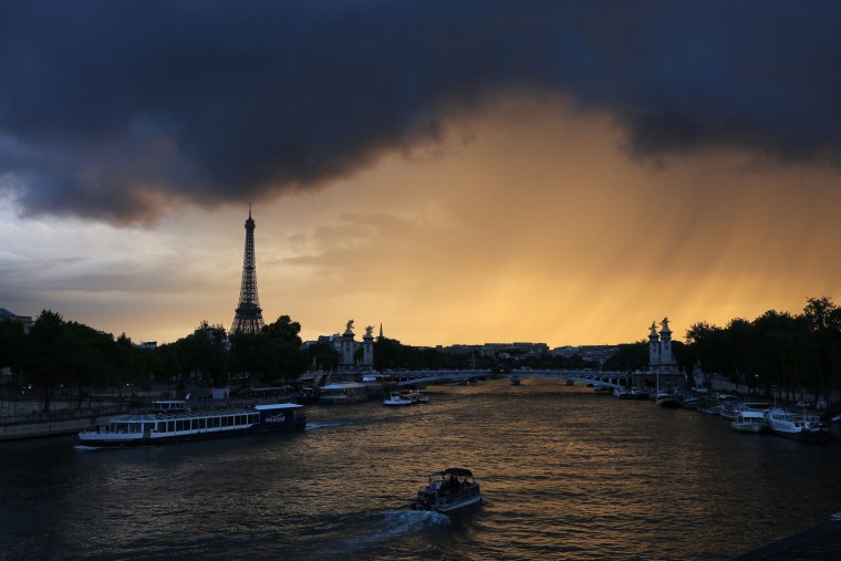 Image: Dark clouds and rain loom over Paris