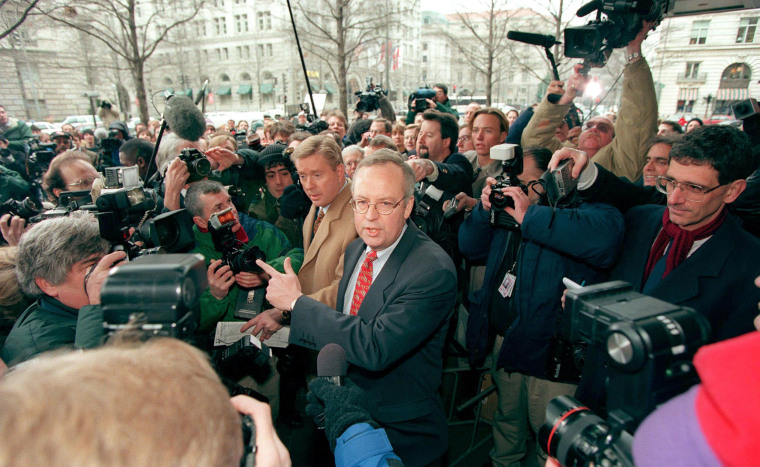 Image: Kenneth Starr, independent Whitewater counsel, is mobbed by the media as he makes his way to a bank of microphones before a press conference on Jan. 22, outside Starr's Washington, DC office.