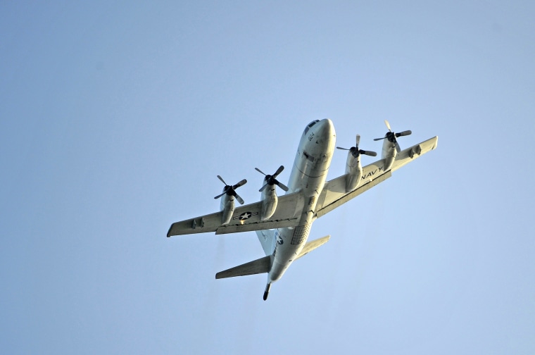 Image:  A U.S. Navy P-3 Orion performs a flyover in Hawaii