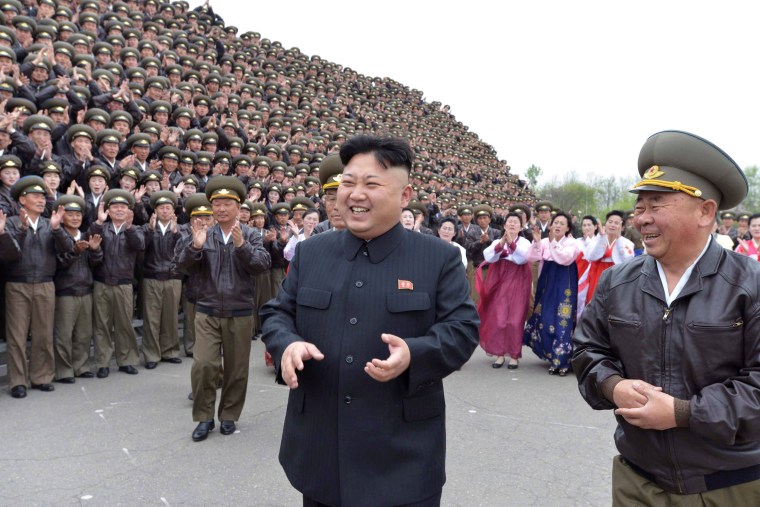 Image: FILE PHOTO : North Korean leader Kim Jong Un laughs with General Ri Pyong-chol at a photo session with participants of first meeting of airpersons of Korean People's Army in Pyongyang