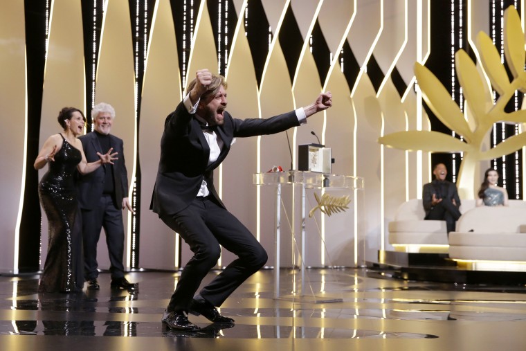 Image: Director Ruben Ostlund, right, celebrates winning the Palme d'Or award for his film The Square, during the awards ceremony at the 70th international film festival, Cannes, southern France, May 28, 2017.