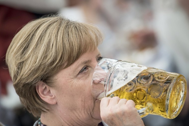Image: German Chancellor Angela Merkel drinks from a beer during an election campaign event of the German Christian Social Union (CSU) party at the 46th Truderinger Festwoche festival week in Munich, Bavaria, Germany, May 28, 2017.