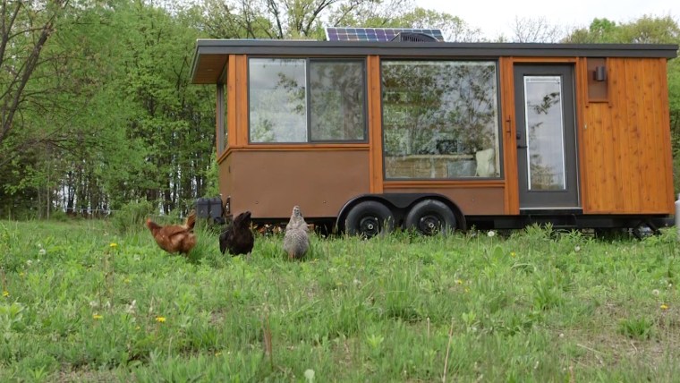 The tiny glass-paneled house sits on at 27-acre farm, near a chicken coop. Eggs anyone?