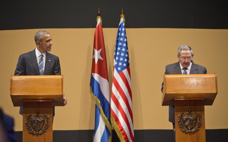 Image: President Barack Obama listens as Cuban President Raul Castro speaks
