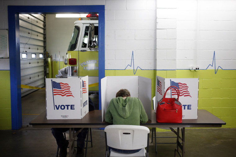 Image: Voters cast ballots inside the Prairie Township Fire Station polling location