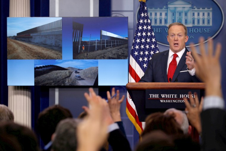 Image: Spicer discusses the building of a proposed border wall with Mexico during his daily briefing at the White House in Washington