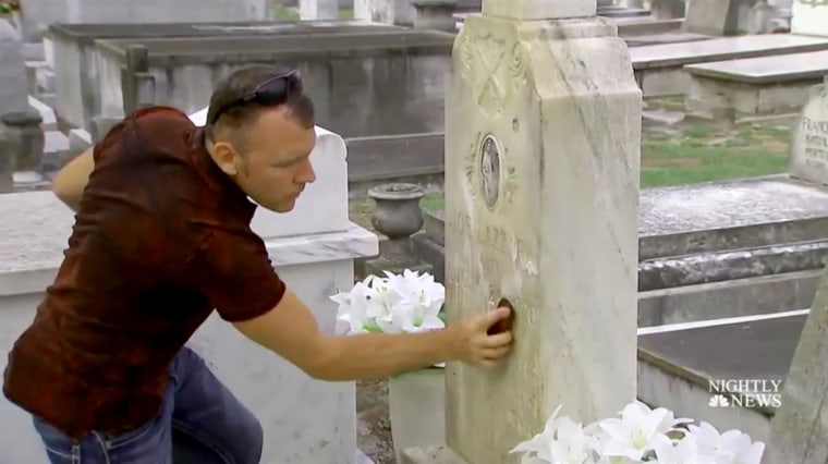 Image: Andrew Lumish, Tampa's \"good cemeterian\" cleans the headstones of fallen soldiers.