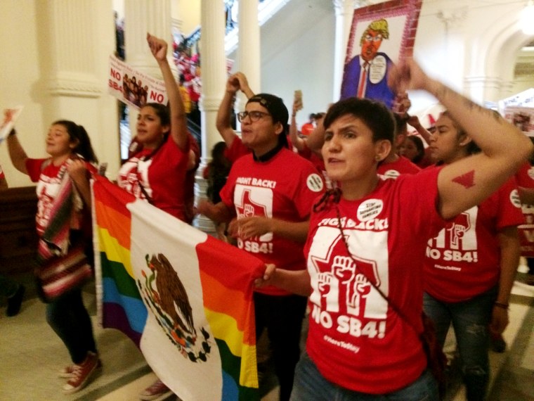 Image: Demonstrators march in the Texas Capitol on May 29, 2017, protesting the state's newly passed anti-sanctuary cities bill in Austin, Texas.