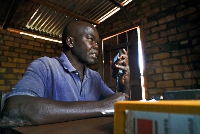 Image: Firmin Gbiara operates the radio in Obo