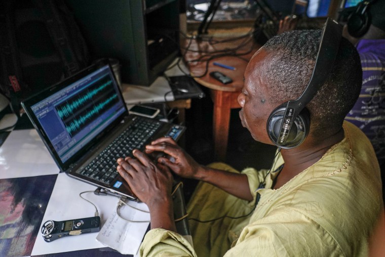 Image: A local volunteer at Radio Mbari in Bangassou edits together an interview he conducted of a local official