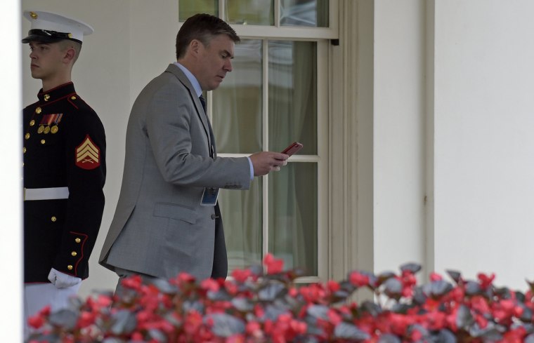 Image: Michael Dubke walks out of the West Wing of the White House in Washington