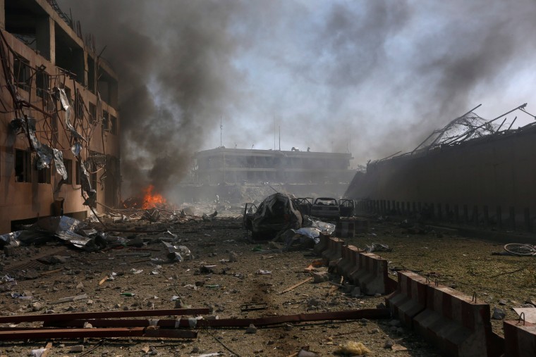 Image: Damaged cars are seen after a blast in Kabul, Afghanistan