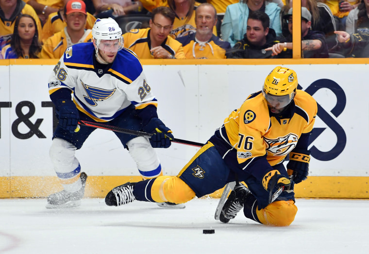 Nashville Predators defenseman P.K. Subban, center, wears a cowboy hat as  he and his teammates warm up in Hockey Fights Cancer jerseys before an NHL  hockey game against the Washington Capitals Tuesday