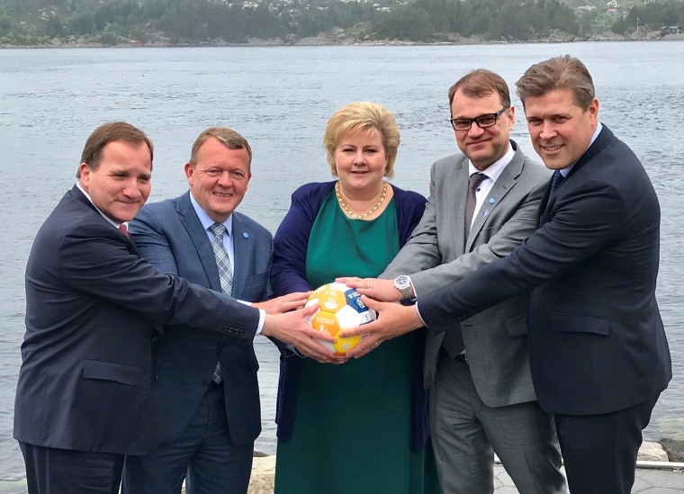 Image: Sweden's PM Lofven with his counterparts Rasmussen of Denmark, Solberg of Norway, Sipila of Finland and Benediktsson of Iceland hold a soccer ball during their meeting in Bergen