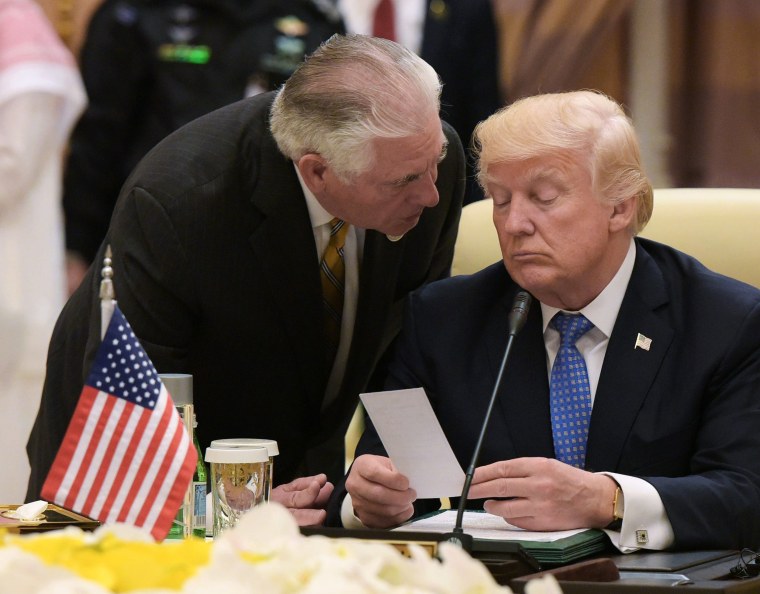 Image: President Donald Trump listens to U.S. Secretary of State Rex Tillerson during a meeting in Riyadh