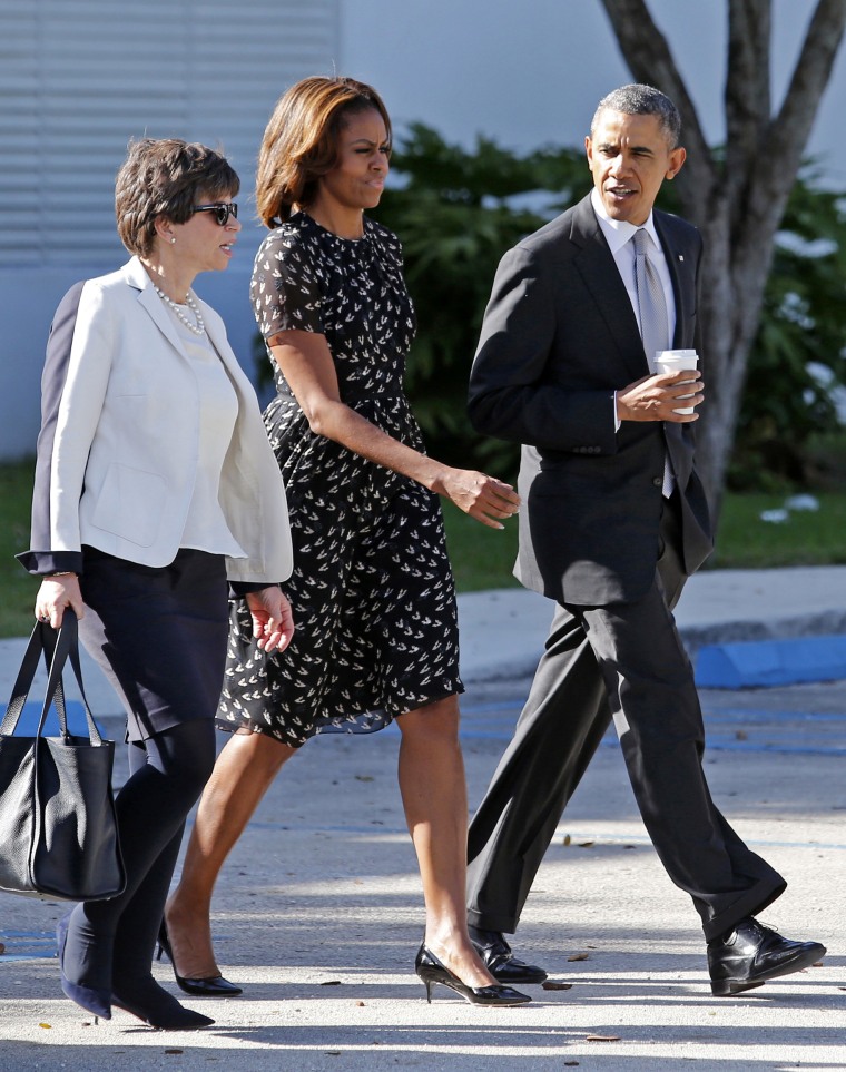 Image: U.S. President Obama leaves after visit to the Coral Reef High School in Miami