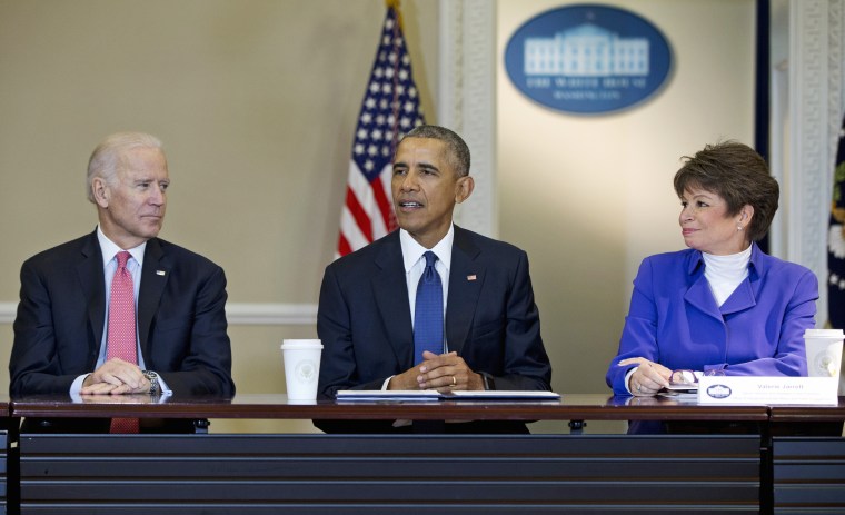 Image: Former President Barack Obama, joined by Vice President Joe Biden, left, and Senior White House Adviser Valerie Jarrett