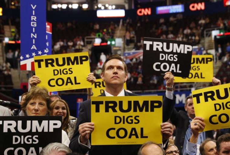 Delegates from West Virginia hold signs supporting coal on the second day of the Republican National Convention in Cleveland, Ohio