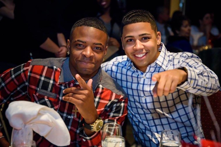 Guests pose at a holiday party held at the Canadian Museum of Immigration at Pier 21 in Nova Scotia.