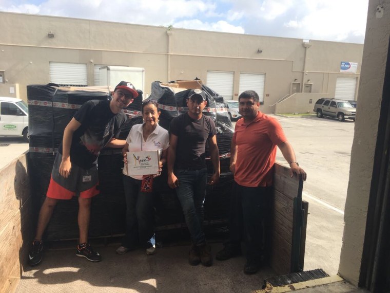 Hilda Marina Alcala (center) with volunteers from Move Org, a group that has recently stopped sending supplies to Venezuela after the government banned what it calls "war materials." 