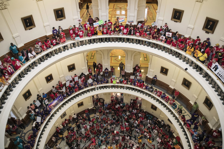 Image: Hundreds of protesters line the balconies of the state Capitol rotunda in Austin