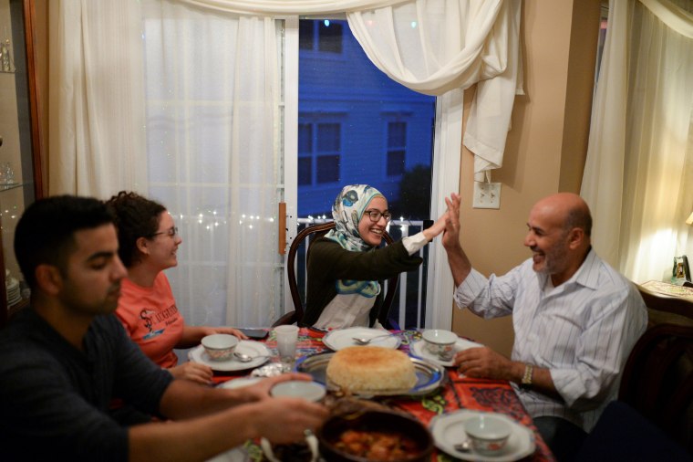 Image: Egyptian American Muslim Elhariry family take part in Iftar dinner during Ramadan in New Jersey
