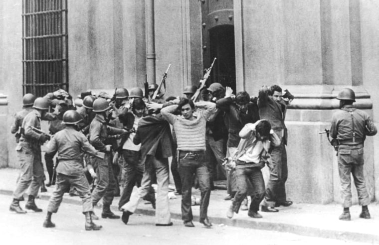 Image: FILE PICTURE SHOWS SOLDIERS CHILEAN AT PRESIDENTIAL PALACE LA MONEDAUNDER FIRE IN 1973.