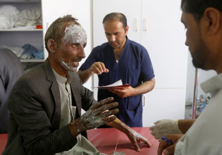Image: An injured man receives treatment at a hospital after the blasts.