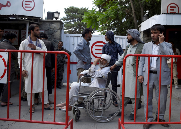 Image: A wounded man sits on a wheelchair after receiving treatment at an Italian aid organization hospital.
