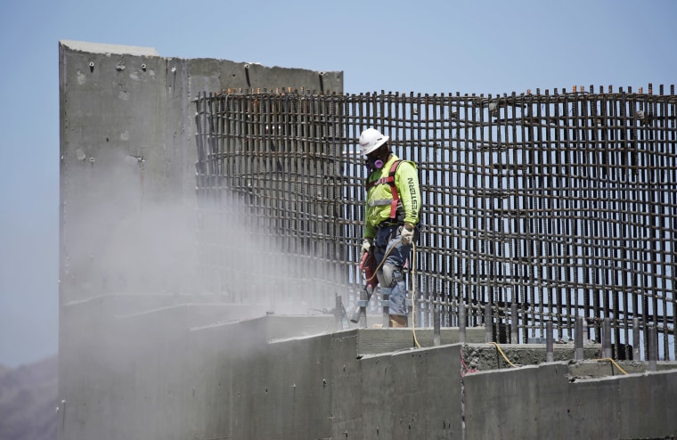 Image: a man works on the Southern Nevada portion of U.S. Interstate 11