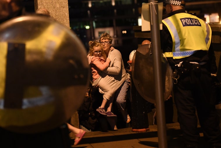 Image: People are lead to safety on Southwark Bridge away from London Bridge after an attack on June 3, 2017 in London, England. Police have responded to reports of a van hitting pedestrians on London Bridge in central London.