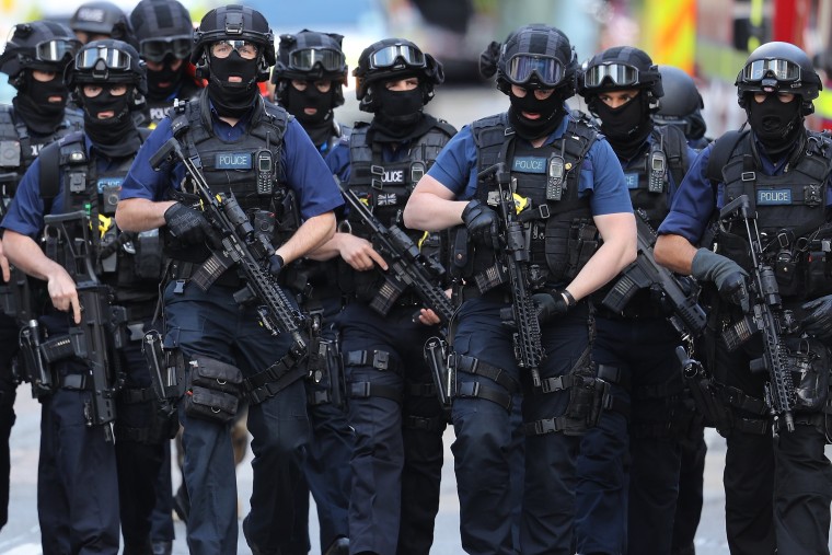 Image: Counter-terrorism officers march near the scene of the London Bridge attack