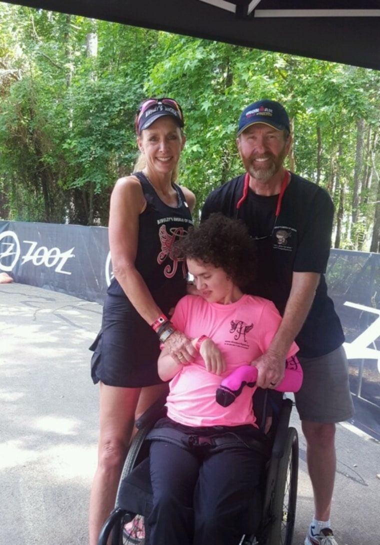 Beth James and her husband David, with Liza.