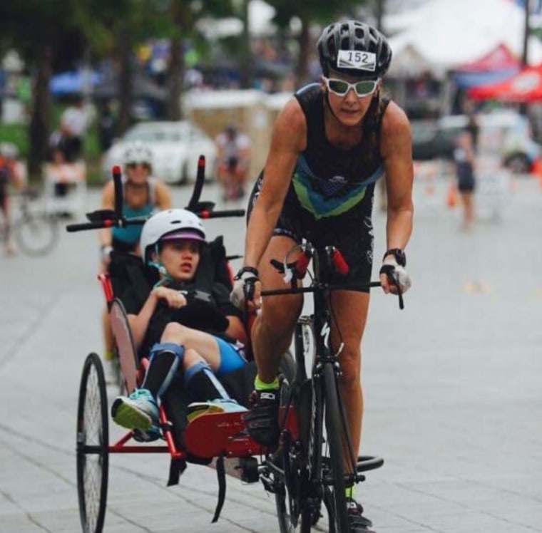 The mother-daughter duo competing in the 2015 Challenged Athletes Foundation Triathlon.