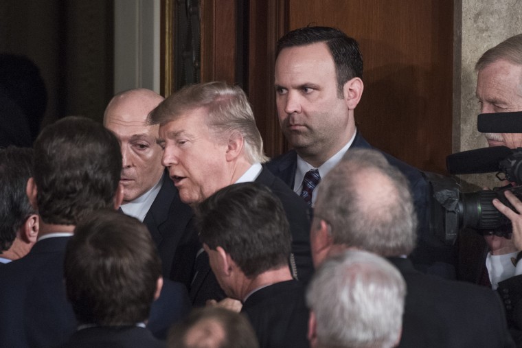 Image: White House aide Dan Scavino looks on as President Trump leaves the Capitol's House Chamber