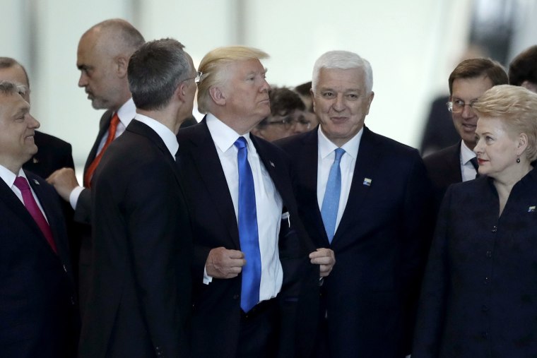 Image: Montenegro Prime Minister Dusko Markovic, center right, after appearing to be pushed by Donald Trump, during a NATO summit