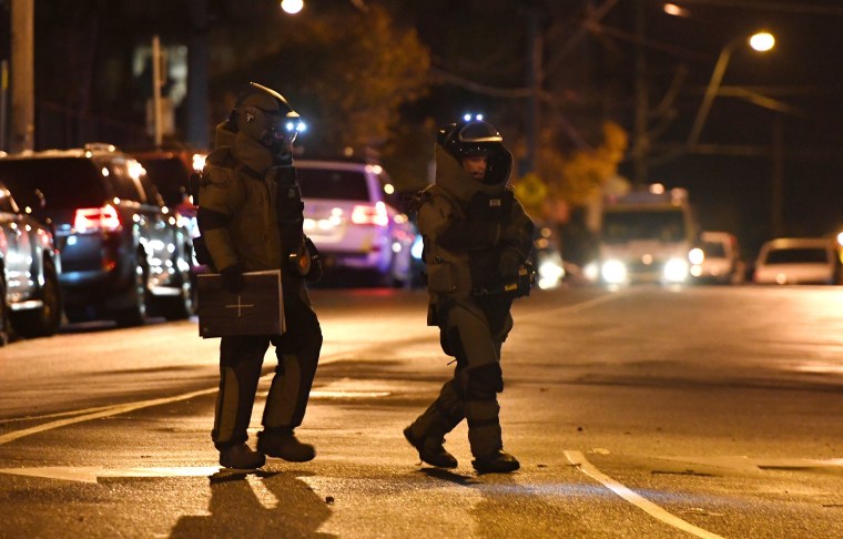 Image: Bomb squad police enter the Buckingham Serviced Apartments on Bay Street in Brighton, Melbourne