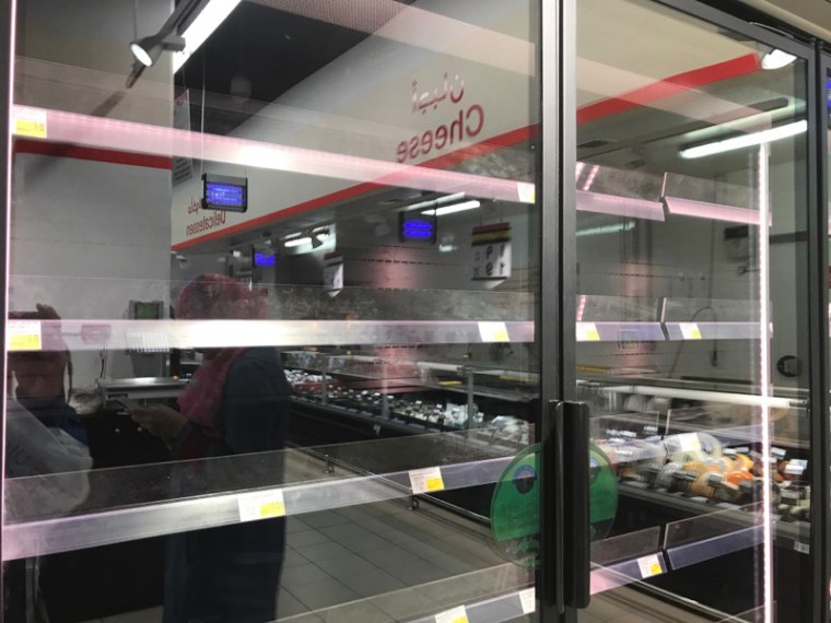 Image: Empty shelves in a supermarket in Doha, Qatar