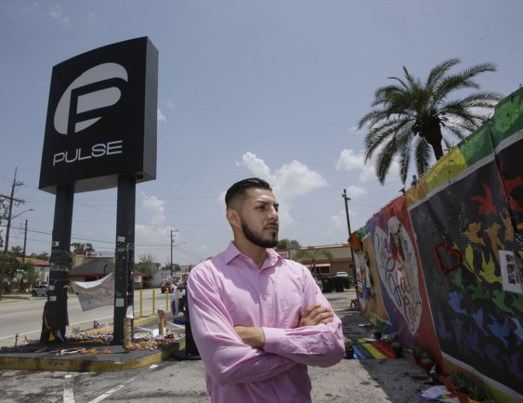 Marco Quiroga, who works to support LGBTQ and social-justice causes in central Florida, reflects in front of one of the memorials at the Pulse Nightclub in Orlando, Fla.