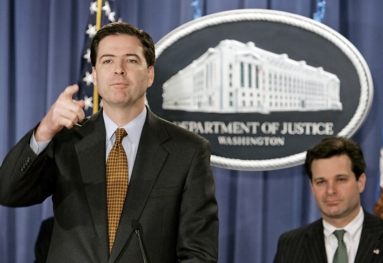 Image: James B. Comey speaks with assistant attorney general Christopher Wray