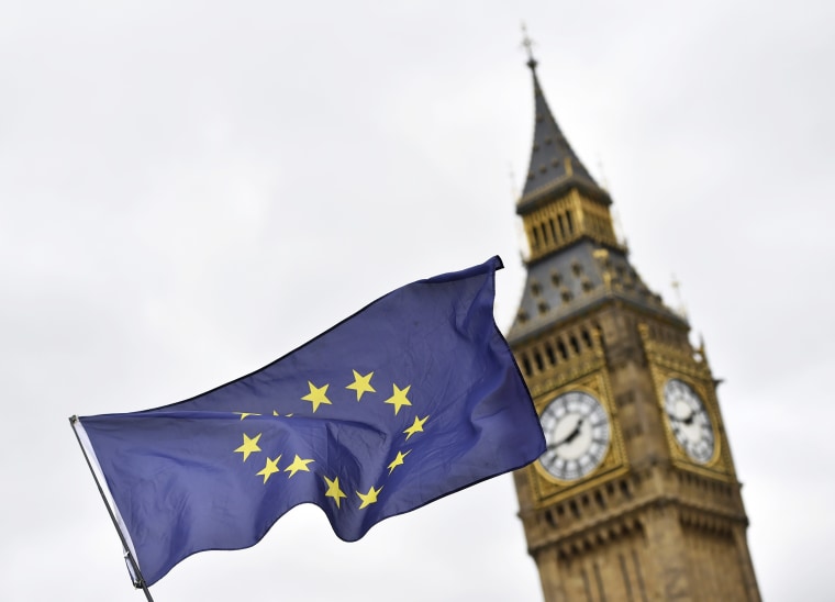 Image: A European Union flag flies in front of the UK Parliament