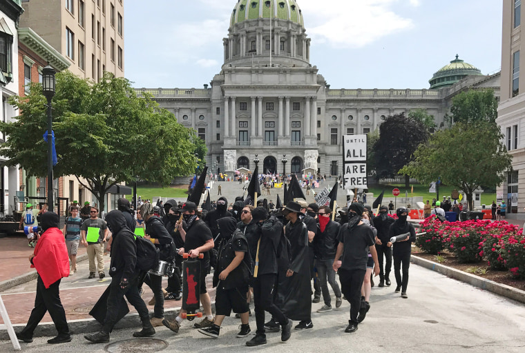 Image: Demonstrators march during an Anti-Sharia rally in front of the State Capitol building in Harrisburg