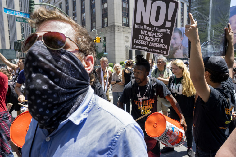 Counter demonstrators yell towards a nearby rally protesting Islamic law Saturday, June 10, 2017, in New York.