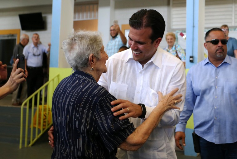 Image: Puerto Rico's Governor Ricardo Rossello greets supporters at a polling station