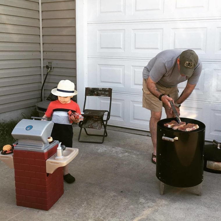Chris grilling with his son Ian