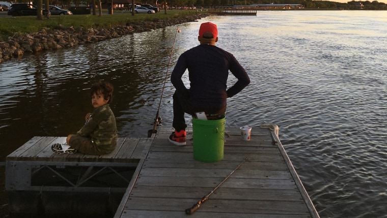 Malik William's last moments fishing with his 6-year-old son Jaden were captured by an amateur photographer last week. 