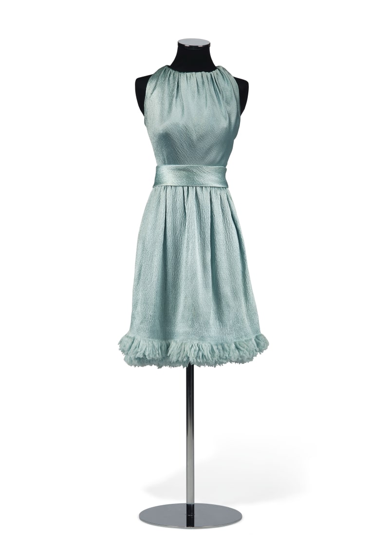 Hubert de Givenchy designed this cloqué silk cocktail dress for Hepburn for a 1966 photo shoot promoting her film “Two for the Road.” 