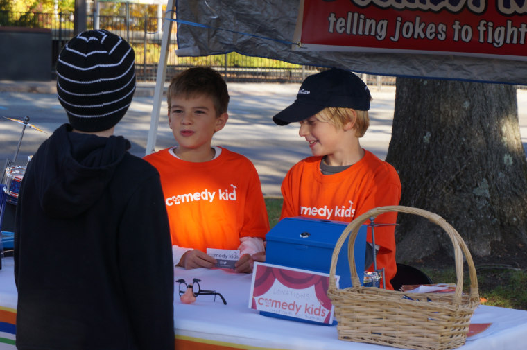 Max and Alex tell a joke during their Comedy Kids fundraiser last November at the Chappaqua Farmer's Market in New York.